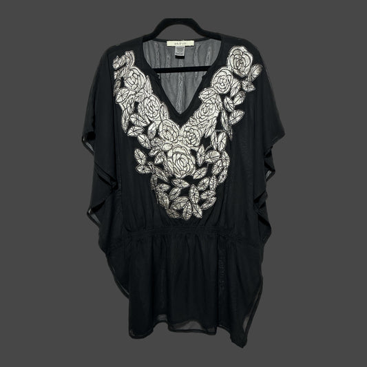 But I Wish It Was Black sheer black tunic with white floral embroidery, V-neck, and flutter sleeves on a hanger.