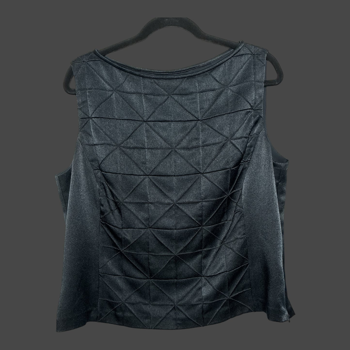 But I Wish It Was Black sleeveless blouse in black with a geometric quilted pattern and a polished boat neckline.