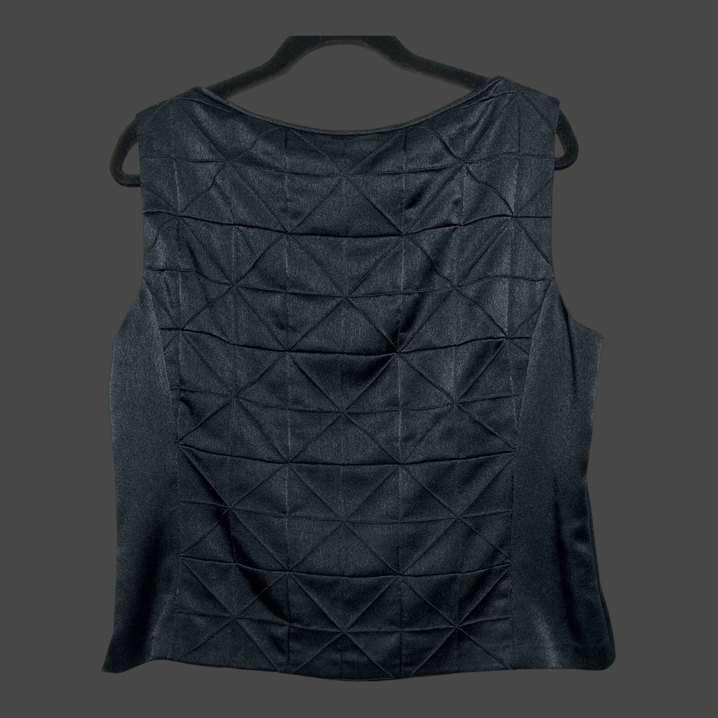 But I Wish It Was Black sleeveless blouse in solid black with a textured geometric quilted front and boat neckline.