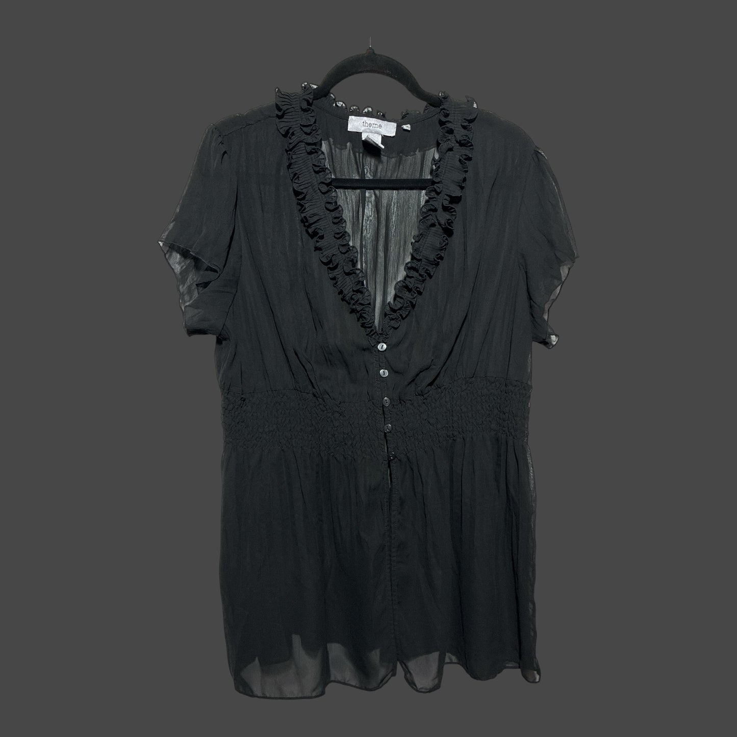 But I Wish It Was Black sheer black chiffon blouse with ruffle V-neck, button-down front, and smocked waist.