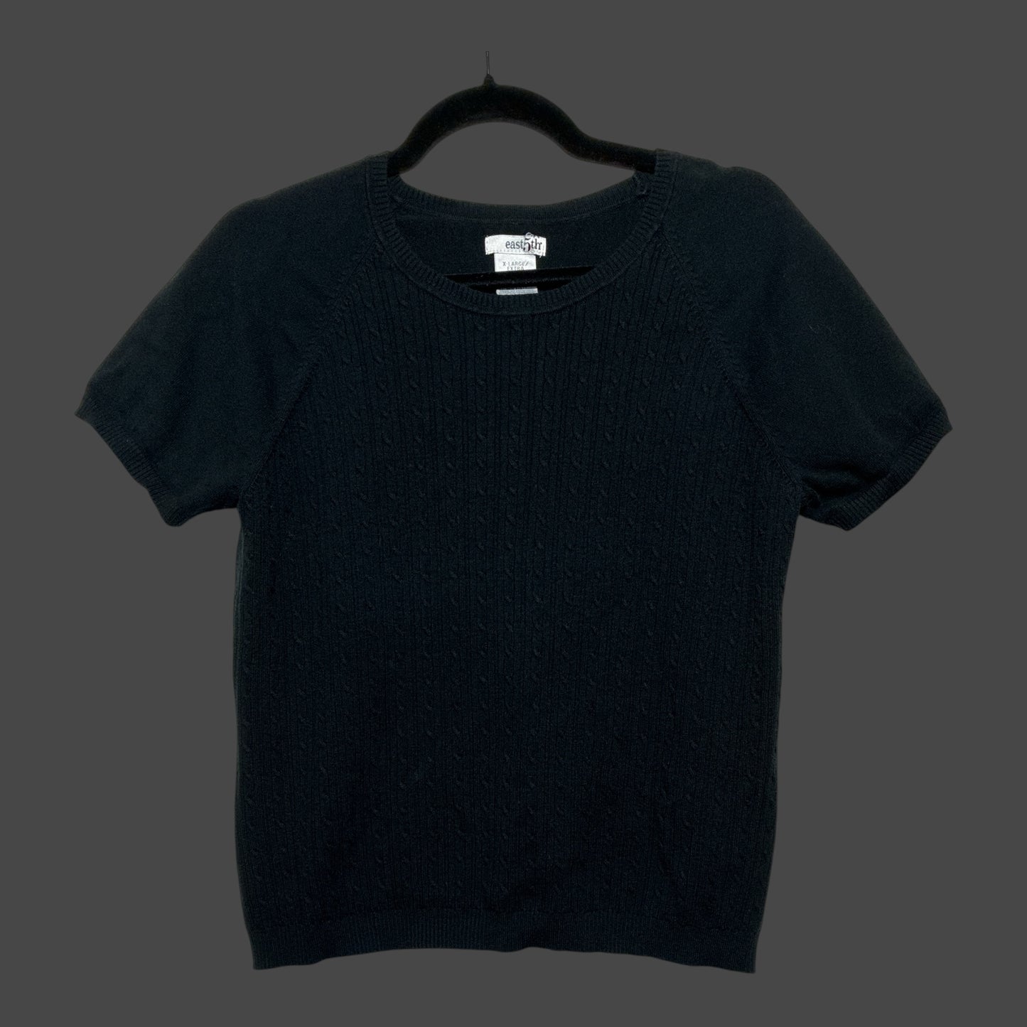 But I Wish It Was Black short sleeve black knit sweater with a crew neck and subtle cable knit texture on the front.