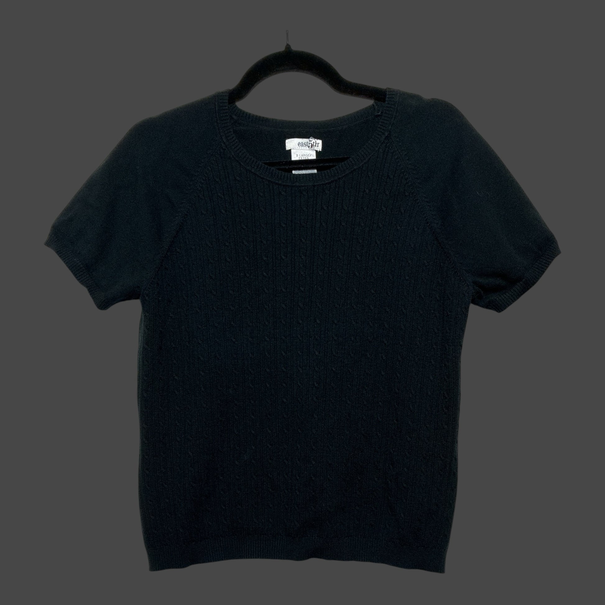 But I Wish It Was Black short sleeve black knit sweater with a crew neck and subtle cable knit texture on the front.