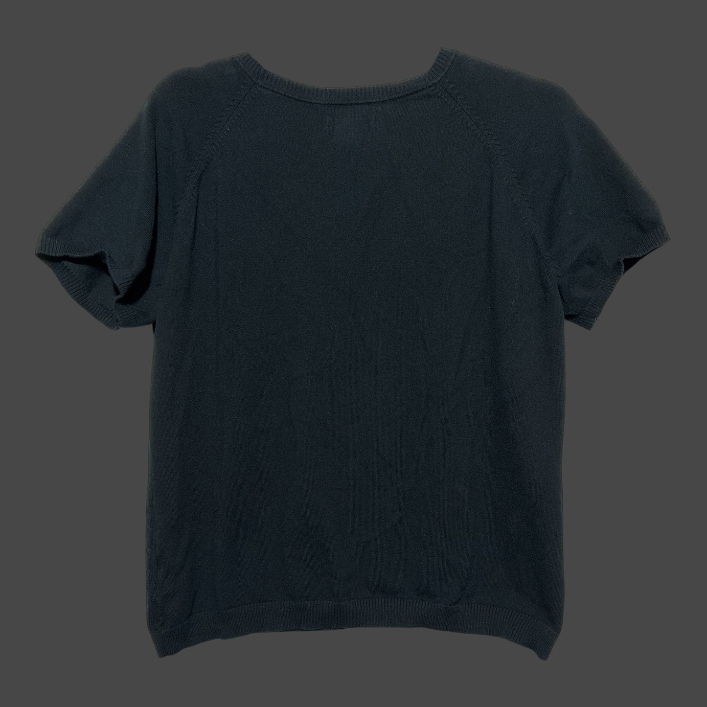 But I Wish It Was Black short sleeve black knit sweater with a crew neck and ribbed trim on a dark background
