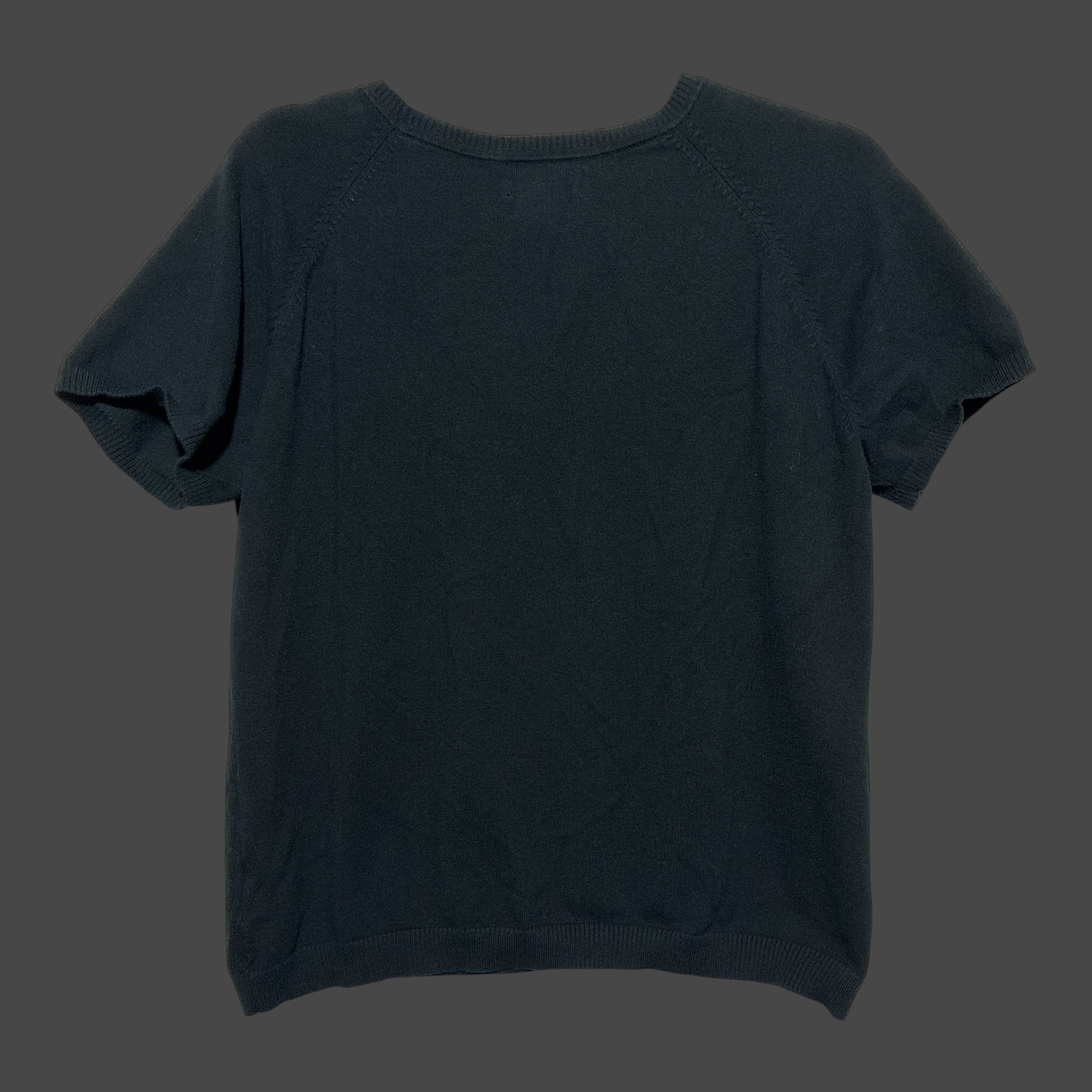 But I Wish It Was Black short sleeve black knit sweater with a crew neck and ribbed trim on a dark background