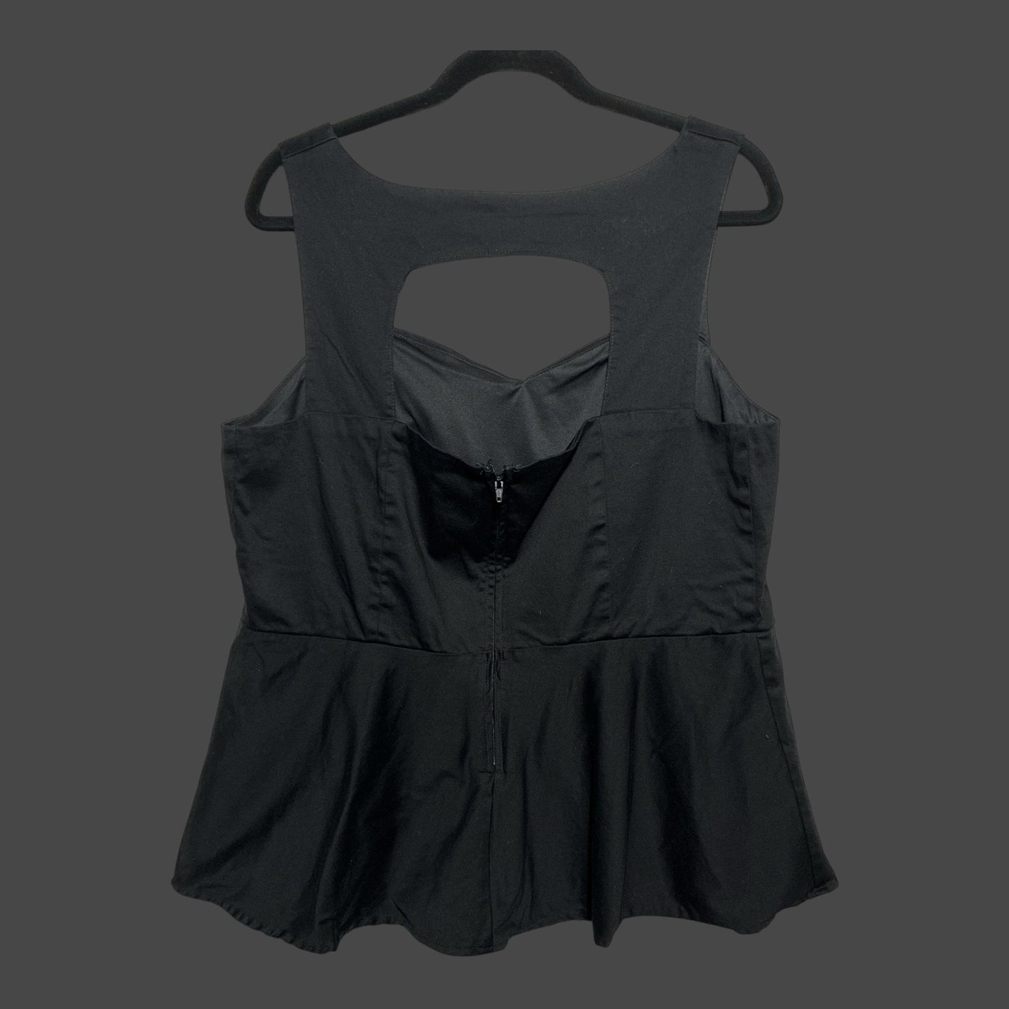 But I Wish It Was Black sleeveless peplum top in black with a sweetheart neckline and back cutout detail