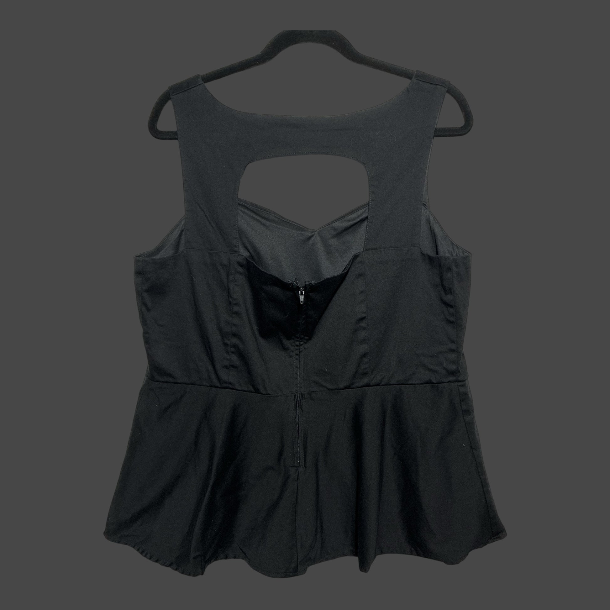 But I Wish It Was Black sleeveless peplum top in black with a sweetheart neckline and back cutout detail