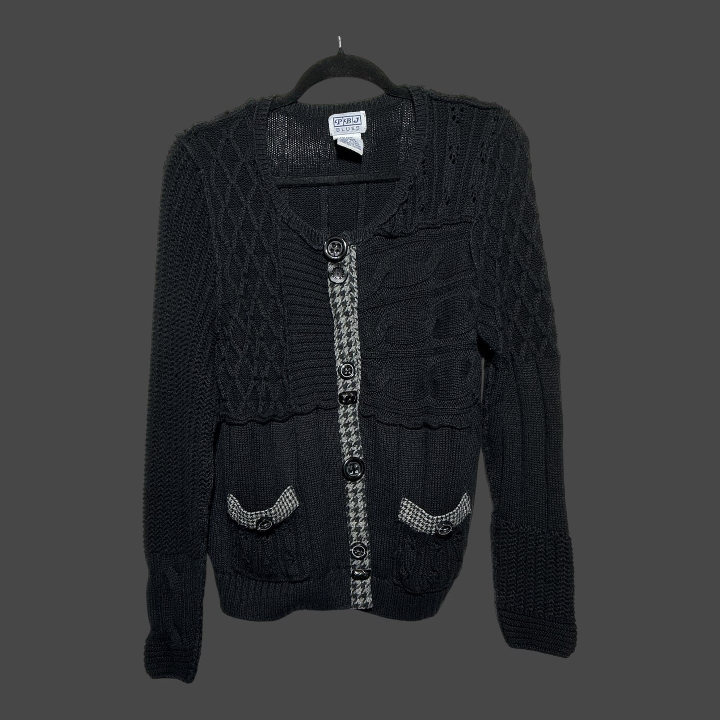 But I Wish It Was Black textured black knit cardigan with houndstooth trim, button front, and two front pockets.